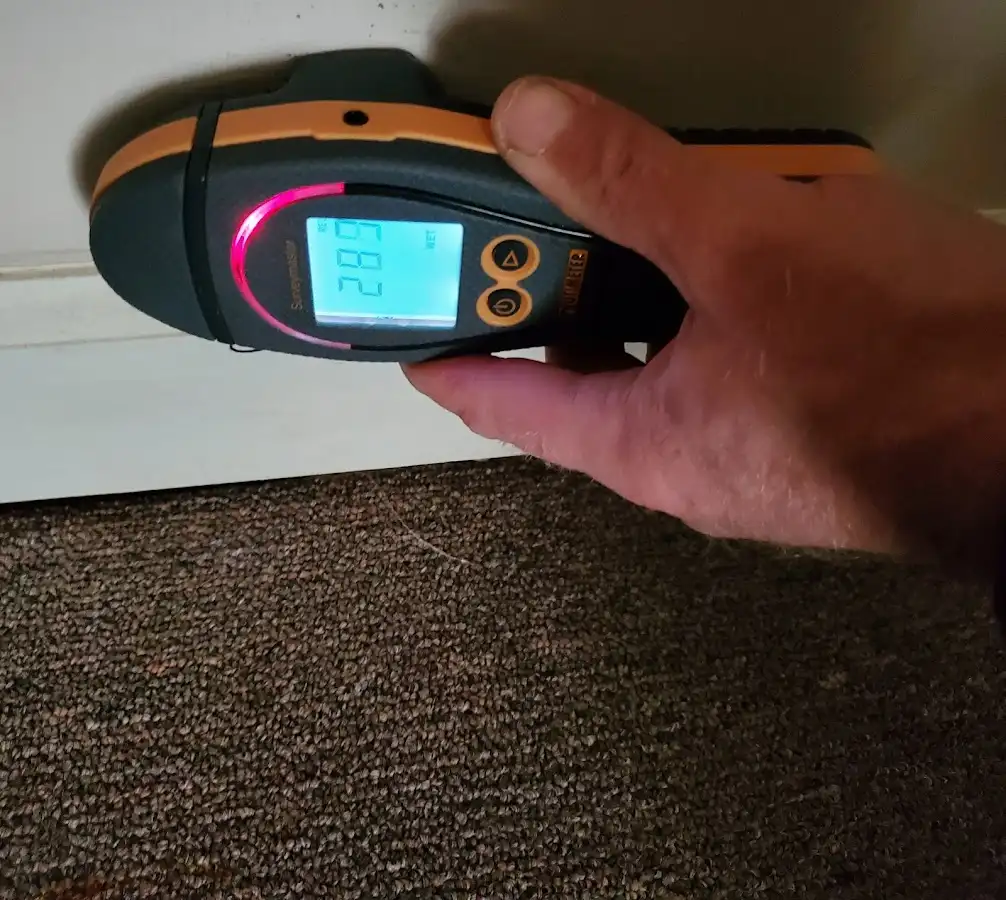 Moisture detection at baseboard during Storm Damage Restoration in Perkasie